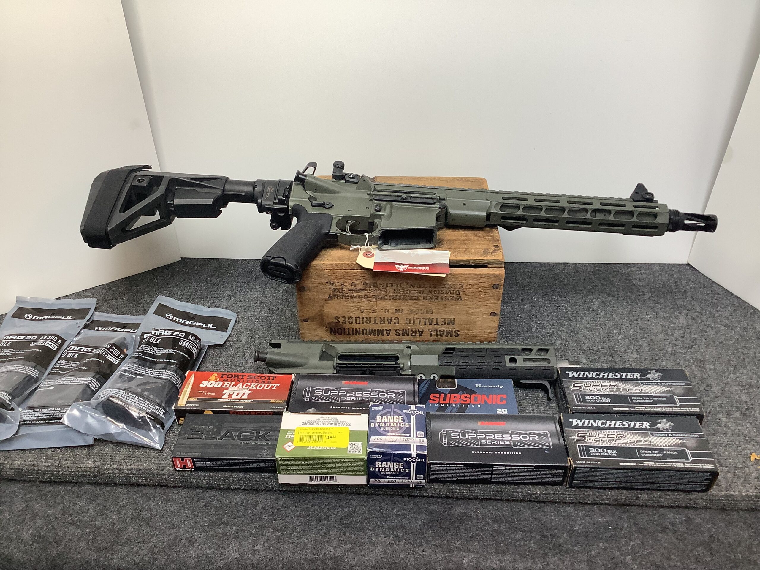 Used Custom Ruger AR with 5.56 upper and 300 BO upper. Comes with tons of ammo!